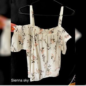 Floral off the shoulder top with straps.